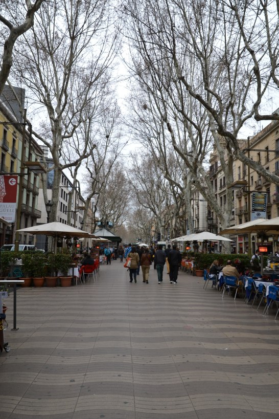 The main street in Barcelona with lots of shops, restaurants and vendors
